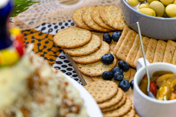 snacks on the table, olives, biscuits, atcha, berries , blueberry, and various crunchies
