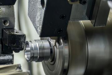 Fototapeta na wymiar The multi-tasking CNC lathe machine swiss type finish cut the metal pipe parts.