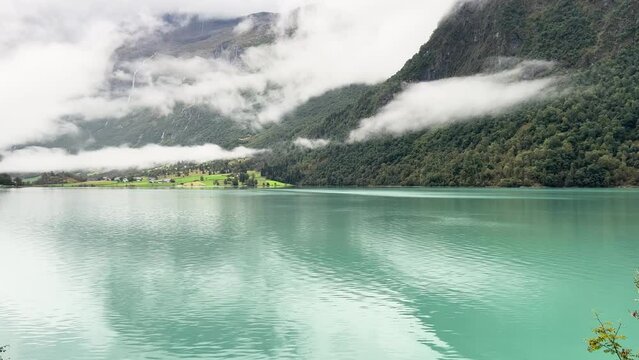 A scene of a very rainy day at Oldevatnet Lake and the Briksdal Valley, Norway