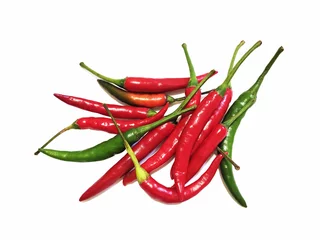 Fotobehang Capsicum, red chili with a white background. Apart from its uses in cooking, it has medicinal uses as well. It helps in digestion. © Okira
