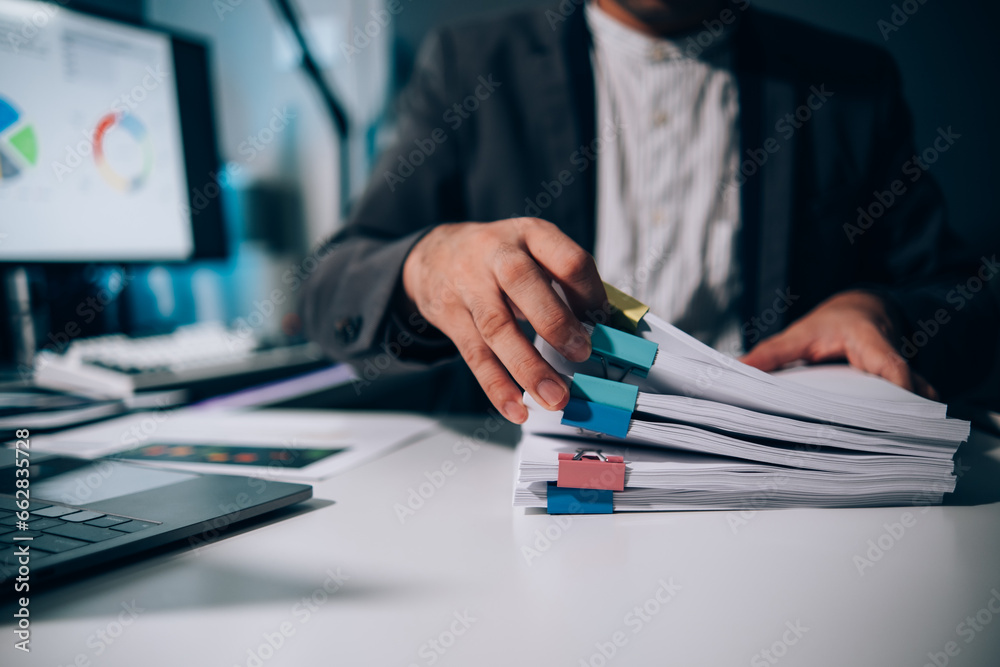 Aufkleber work from home, businessman hands working in stacks of paper files for searching information on work