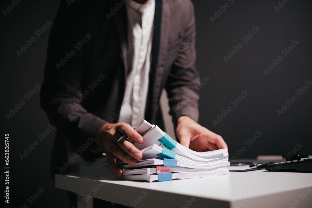 Aufkleber work from home, businessman hands working in stacks of paper files for searching information on work