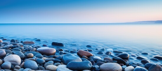 Coastline with stunning scenery water and rocks in long exposure With copyspace for text