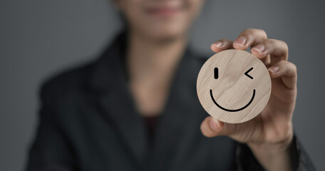 Happy smile relax face in wooden lable. Emotion happiness feed good positive thinking concept....