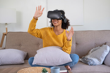 Young woman explores VR entertainment at home.