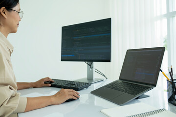 Female IT programmer innovates at office desk.