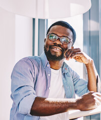 Positive man creating ideas for writing in exercise book