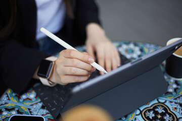 Illustrator drawing a picture on a tablet pc. Freelance graphic designer working on a computer with...