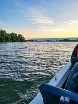 Tourists take a sunrise boat tour through the Danube Delta Biosphere Reserve, Delta Dunarii near Tulcea, Wallachia, Romania, Donaudelta