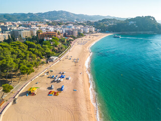 Fenals, Lloret de Mar Aerial view with Drone from the beach, Blue, turquoise, dense water, green vegetation, Mediterranean, transparent, nature, European quality tourism
