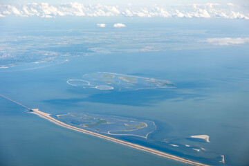 Aerial film, footage from the Marker Wadden, new manmade artificial islands with sandbanks and bird nature reserve, habitat, refuge, shelter along dike in The Netherlands, Europe