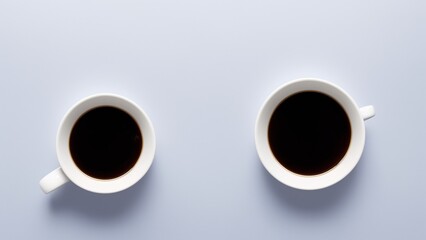 Two Cups Of Coffee On A Blue Background