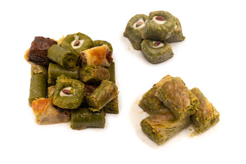 Turkish pistachio baklava isolated on a white background. A variety of turkish sweet baklava.