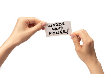 Words have power text on a card in a woman hand isolated.