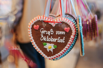 Traditional Lebkuchenherz Gingerbread heart at the famous Oktoberfest in Munich. Reading:...