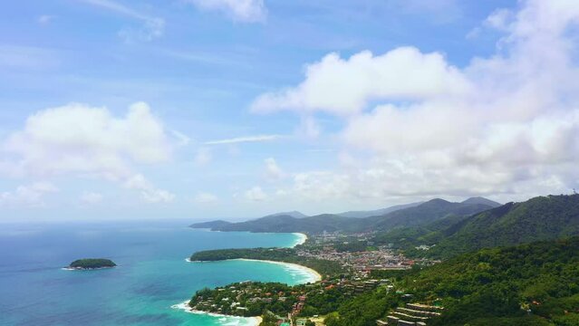 aerial panorama view blue sky over the sea at three beaches viewpoint..popular landmark to see three beaches..Kata Noi beach, Kata beach and Karon beach..white cloud in blue sky background