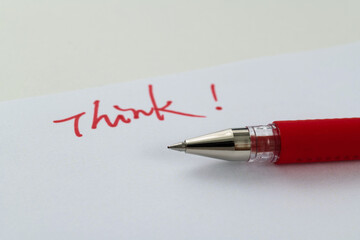 Writing think on white paper
