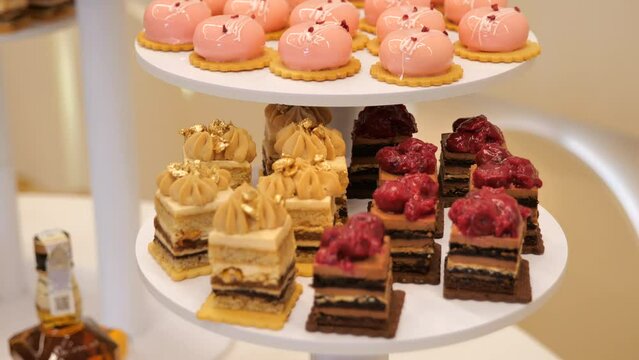 Close up of tray with lot delicious diversity pastry cakes tartlets 	