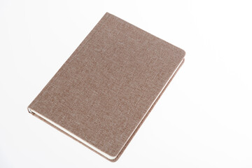 Brown book on white background