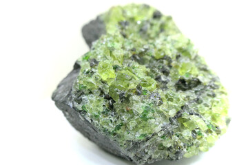 Natural olivine minerals crystallization of which the best pieces is called peridot and used for semi-precious  jewelry stones