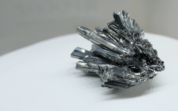 Shiny silver stibnite mineral cluster crystal