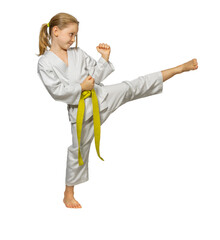 child practising martial arts performs a side kick