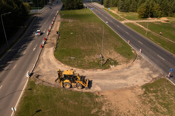 Drone photography of a highway and construction being done on it in a city