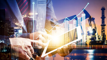 Businessman using digital tablet. Business global internet connection application technology digital marketing, Crude Oil pump oil rig energy industrial machine background. Crude oil increase price