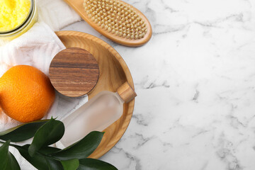 Flat lay composition with cosmetic products on white marble table, space for text. Anti cellulite treatment