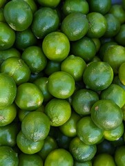 fresh green limes on the market
