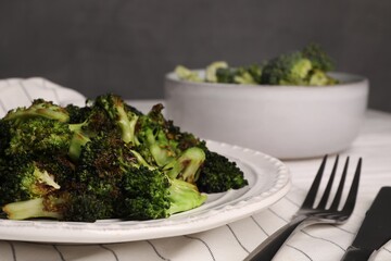 Tasty fried broccoli served on white table, closeup