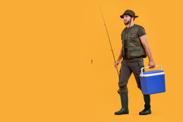 Fisherman with fishing rod and cool box on yellow background, space for text