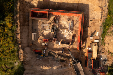Drone photography of small construction site and workers building a building during Summer sunny day