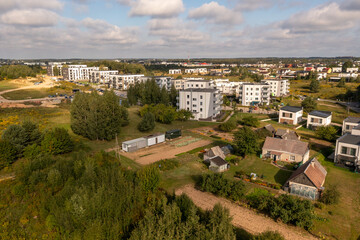 Fototapeta premium Drone photography of new multistory apartments in a a rural landscape