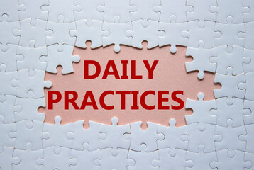 Daily Practices symbol. White puzzle with words Daily Practices. Beautiful pink background. Psychology and Daily Practices concept. Copy space.