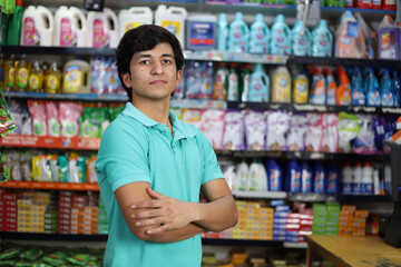 Portrait of Happy and smiling fit boy purchasing in a grocery store. Buying grocery for home in a supermarket.