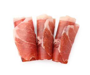 Rolled slices of delicious jamon isolated on white, top view