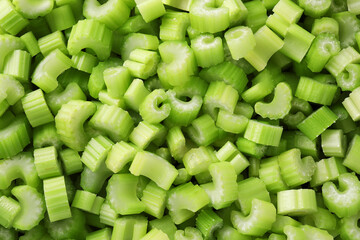 Fresh green cut celery as background, top view