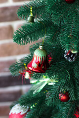 Christmas tree decorated with red balls and bells. Christmas. Festive Interior