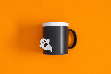 Halloween holiday with party decorations on orange background. Halloween concept. Flat lay, top view, copy space