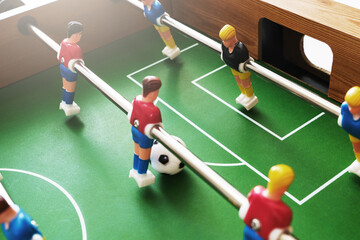 Close-up view of a table football game in progress