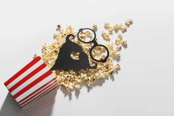 Popcorn bucket and photo booth prop for movie party © blackday