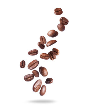 Coffee beans scattered in the air isolated on a white background. Falling coffee beans on white space