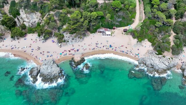 Cala sa Boadella beach in the resort town of Lloret de Mar, Spain. View from a drone, photo from above.