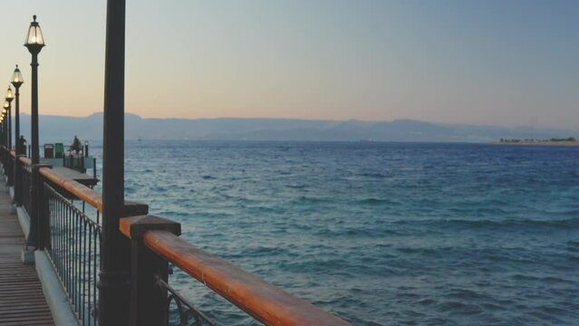 bridge on the beautiful beach. Tropical resort in Tala Bay, Hashemite Kingdom of Jordan. Red sea, gulf of Aqaba. View on Israel and Egypt on the other coast