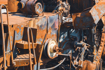 Damaged agricultural equipment destroyed by artillery fire (close-up). War in Ukraine