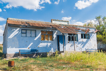 Fototapeta na wymiar Countryside. A house destroyed by shelling. War in Ukraine
