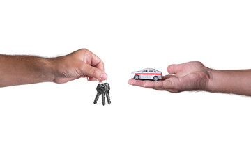 Car keys in hand on a white background. Car on the palm on a white background.
Purchasing a car. Buying a new car.