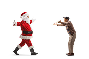Full length profile shot of santa claus meeting a friend