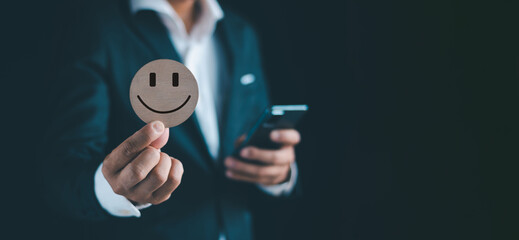 Businessmen hold signboards, smile, be happy, get good feedback, have a cheerful mind, and are satisfied with customer evaluation, which is World Mental Health Day.